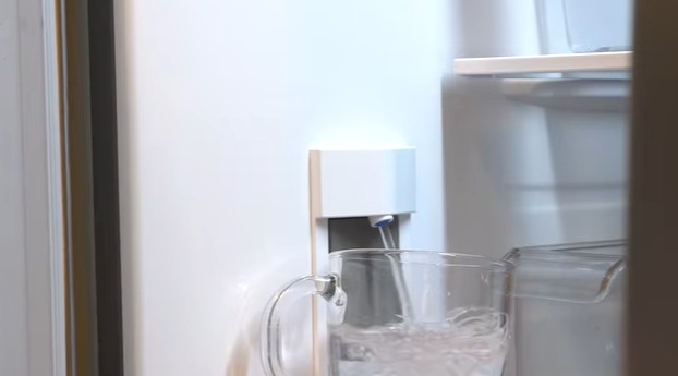 Water pouring into a pitcher from the internal dispenser